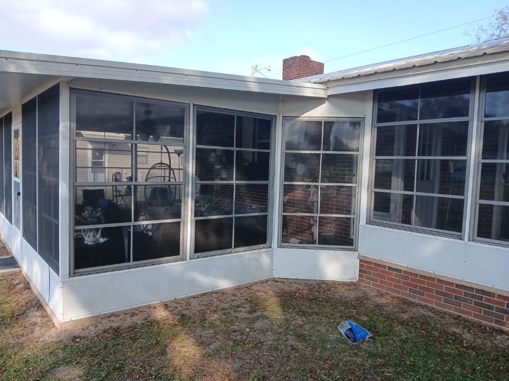 Glass and screen enclosed sunroom exterior view